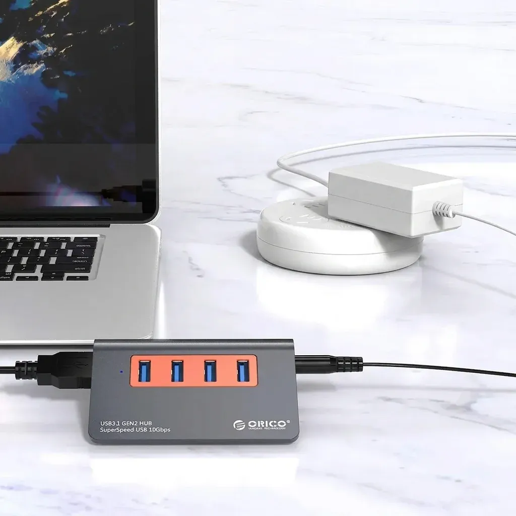 موزّع ORICO رباعي المنافذ USB 3.1 Gen2 مع طاقة خارجية 10 جيجابت/ثانية